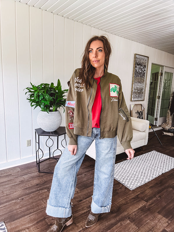 Olive classic bomber jacket with western inspired patchwork and embroidery throughout with zip up front and elastic waist, collar and cuffs.