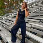 Black textured wide leg lounge pants with elastic waist.