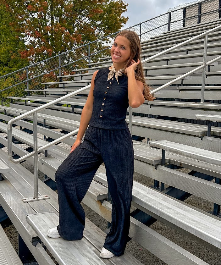 Black textured wide leg lounge pants with elastic waist.