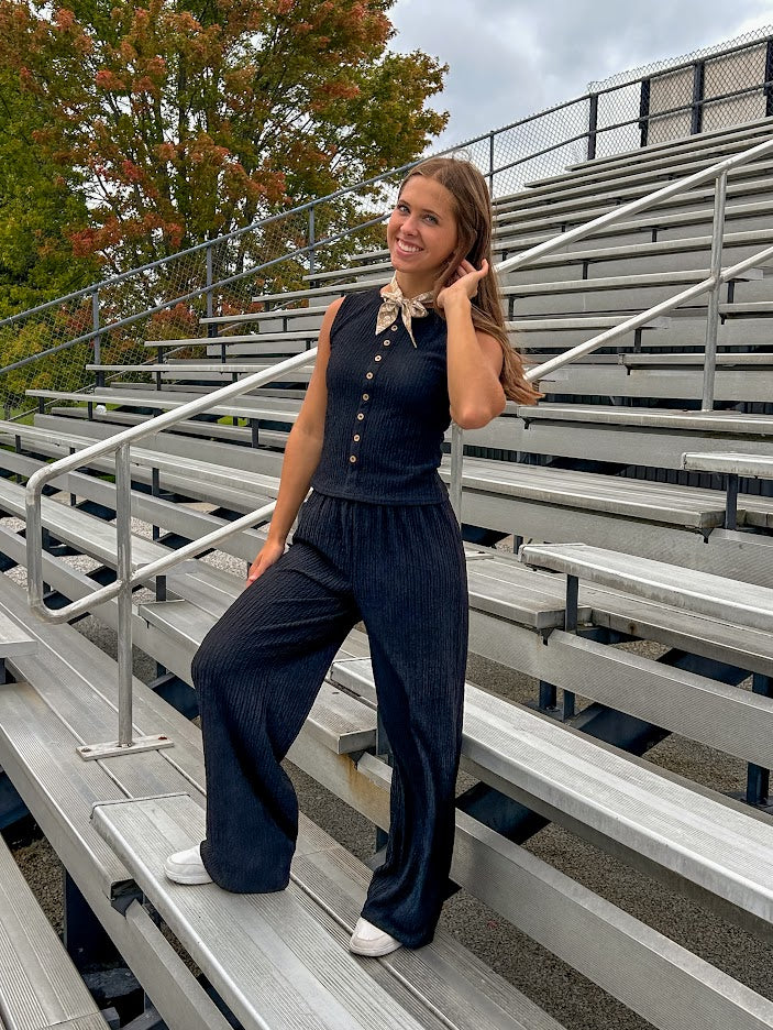 Black textured wide leg lounge pants with elastic waist.