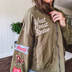 Olive classic bomber jacket with western inspired patchwork and embroidery throughout with zip up front and elastic waist, collar and cuffs.