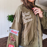 Olive classic bomber jacket with western inspired patchwork and embroidery throughout with zip up front and elastic waist, collar and cuffs.