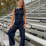 Black textured wide leg lounge pants with elastic waist.
