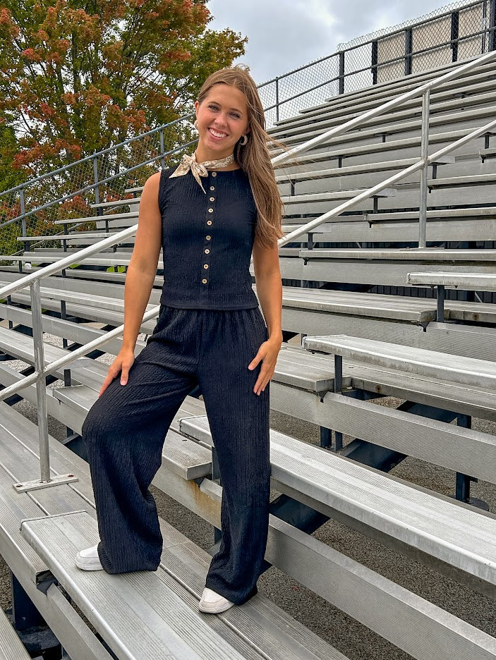 Black textured wide leg lounge pants with elastic waist.