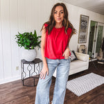 Cool red cotton blend bubble hem blouse tank with padded shoulders with shoulder pleats and round neck.
