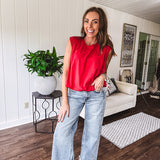 Cool red cotton blend bubble hem blouse tank with padded shoulders with shoulder pleats and round neck.