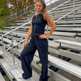 Black textured wide leg lounge pants with elastic waist.