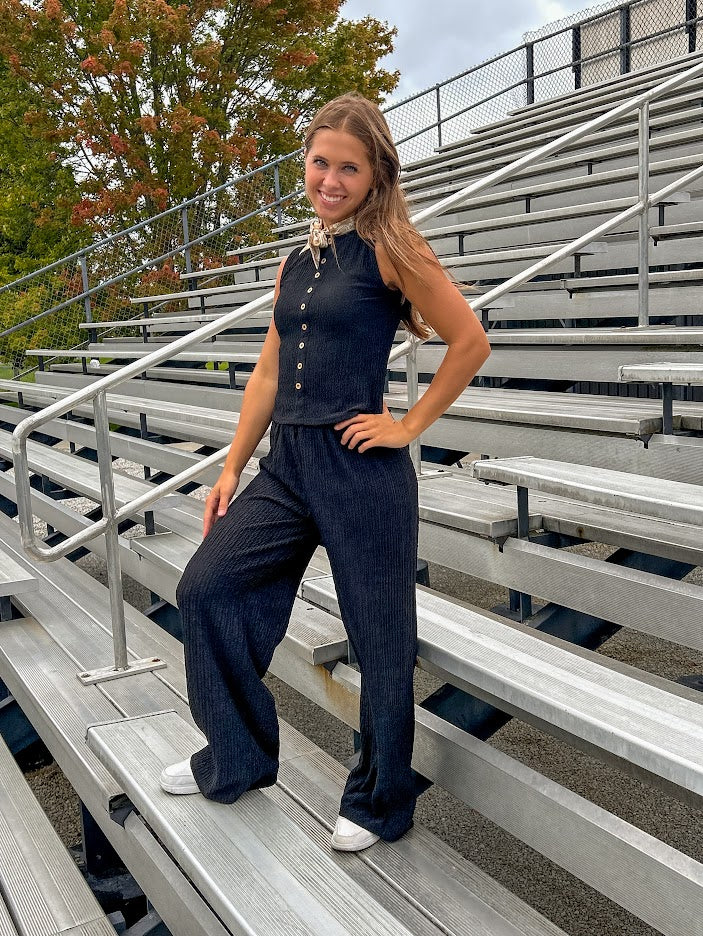 Black textured wide leg lounge pants with elastic waist.