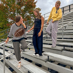 Black textured wide leg lounge pants with elastic waist.