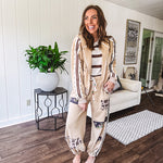 Lightweight, nearly sheet knit sweater with capped sleeves in cream with dark brown stripes and middle front seam detail.