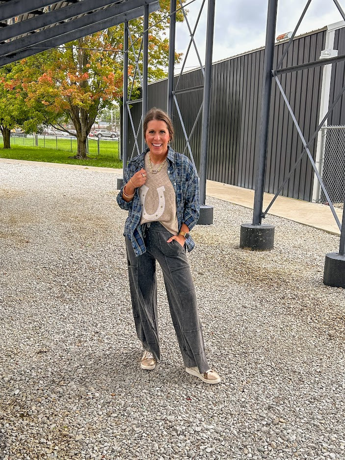 Black terry knit wide leg cargo pants with elastic waist.