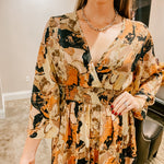 Brown, black, rust and bold geode print maxi dress with V neck, elastic waist and 3/4 sleeves.