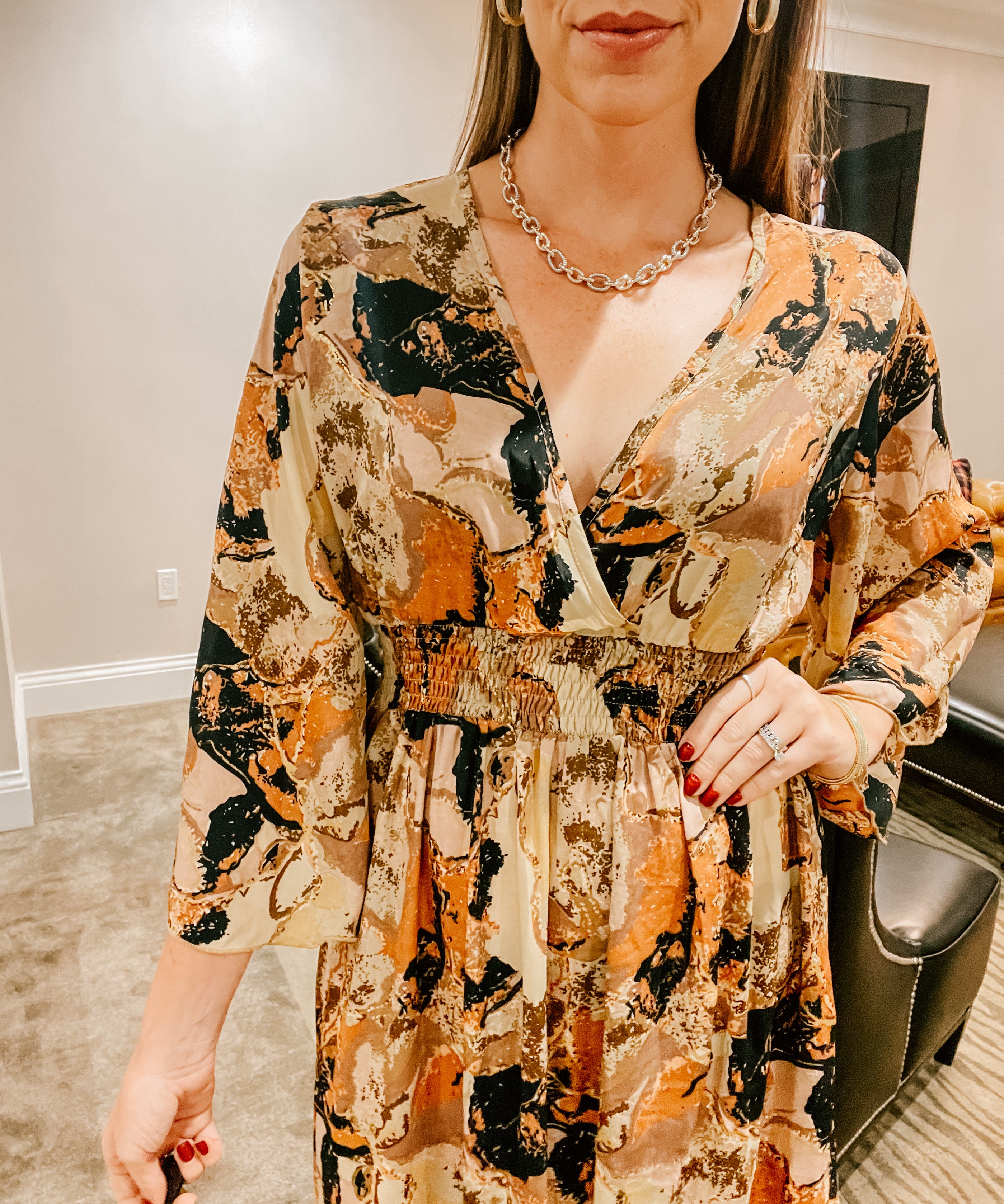 Brown, black, rust and bold geode print maxi dress with V neck, elastic waist and 3/4 sleeves.