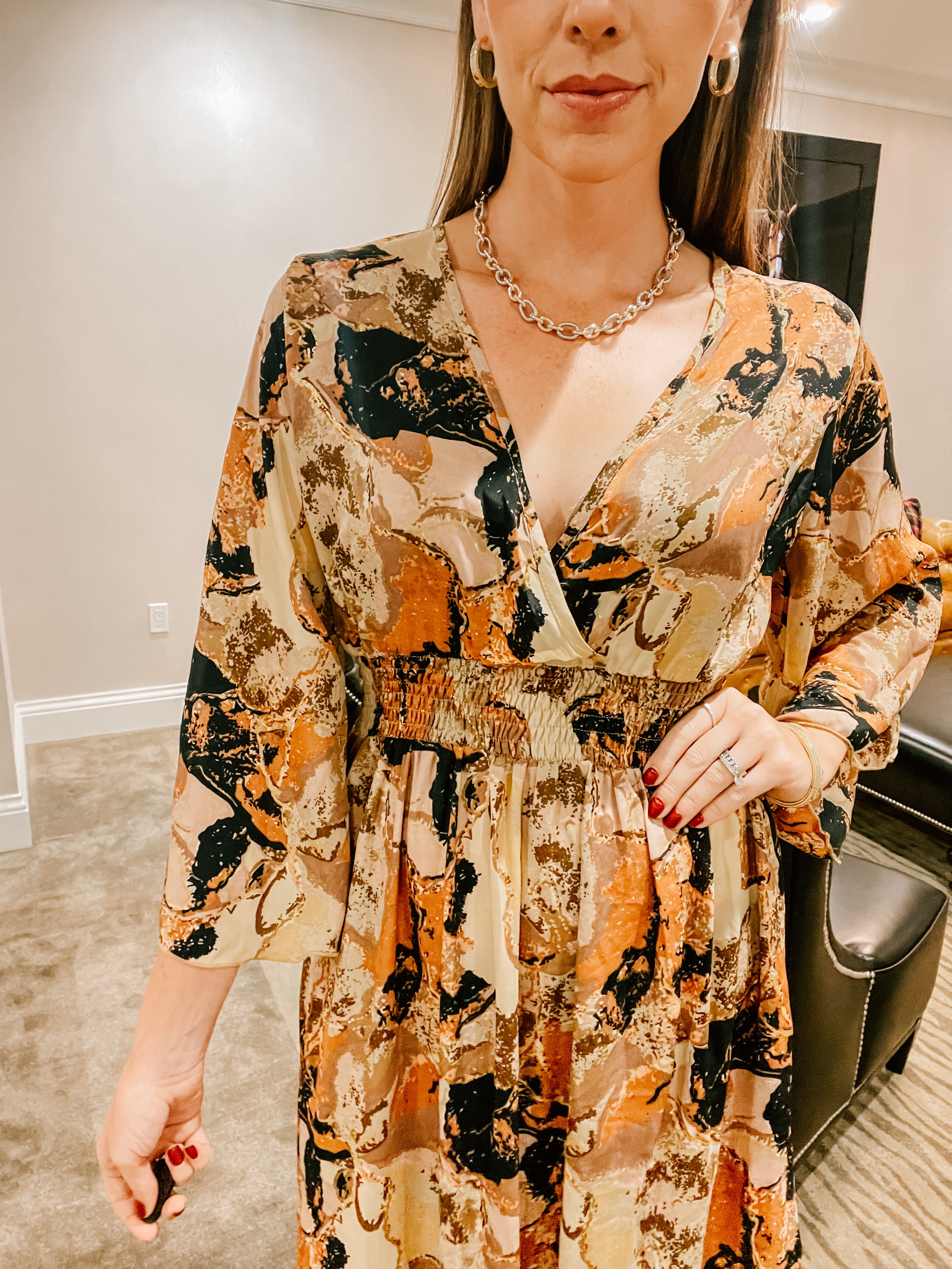 Brown, black, rust and bold geode print maxi dress with V neck, elastic waist and 3/4 sleeves.