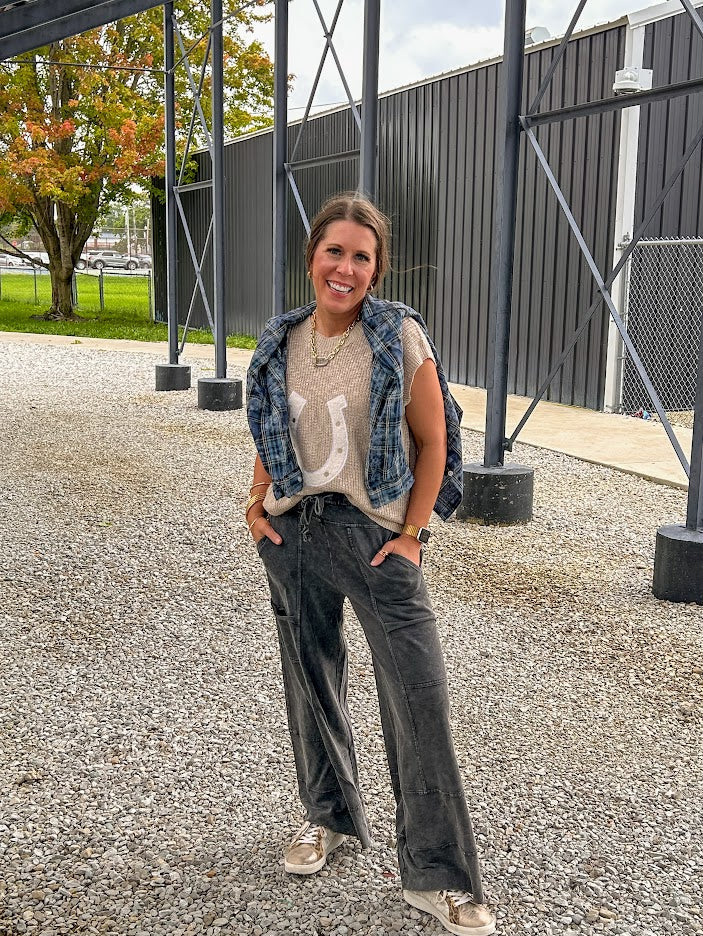 Black terry knit wide leg cargo pants with elastic waist.
