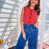 Thin red and white striped sleeveless vest with gold buttons down the front.