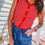 Thin red and white striped sleeveless vest with gold buttons down the front.