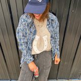 Blue, black and green plaid flannel button down shirt.