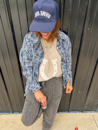 Blue, black and green plaid flannel button down shirt.