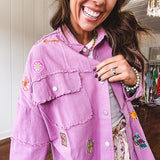Washed orchid lightweight snap button top with exposed seams and groovy patches throughout.