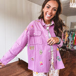Washed orchid lightweight snap button top with exposed seams and groovy patches throughout.