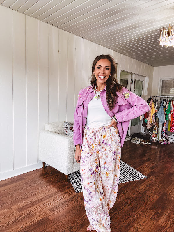 Washed orchid lightweight snap button top with exposed seams and groovy patches throughout.