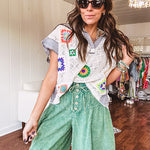 Sheer ivory crochet short sleeved top with bright crochet patches throughout, denim trim at the V neck, collar and sleeves.