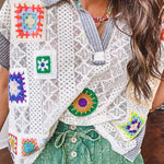 Sheer ivory crochet short sleeved top with bright crochet patches throughout, denim trim at the V neck, collar and sleeves.