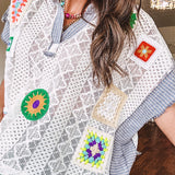 Sheer ivory crochet short sleeved top with bright crochet patches throughout, denim trim at the V neck, collar and sleeves.