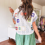 Sheer ivory crochet short sleeved top with bright crochet patches throughout, denim trim at the V neck, collar and sleeves.