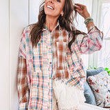 Oversized, lightweight pink, blue, cream and spice mixed plaid long sleeved top with button up front and raw hem.