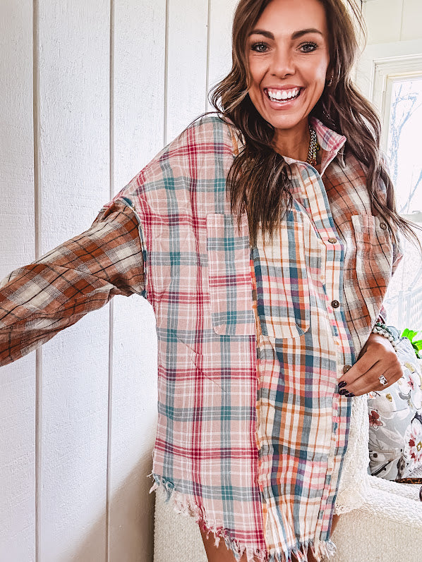 Oversized, lightweight pink, blue, cream and spice mixed plaid long sleeved top with button up front and raw hem.