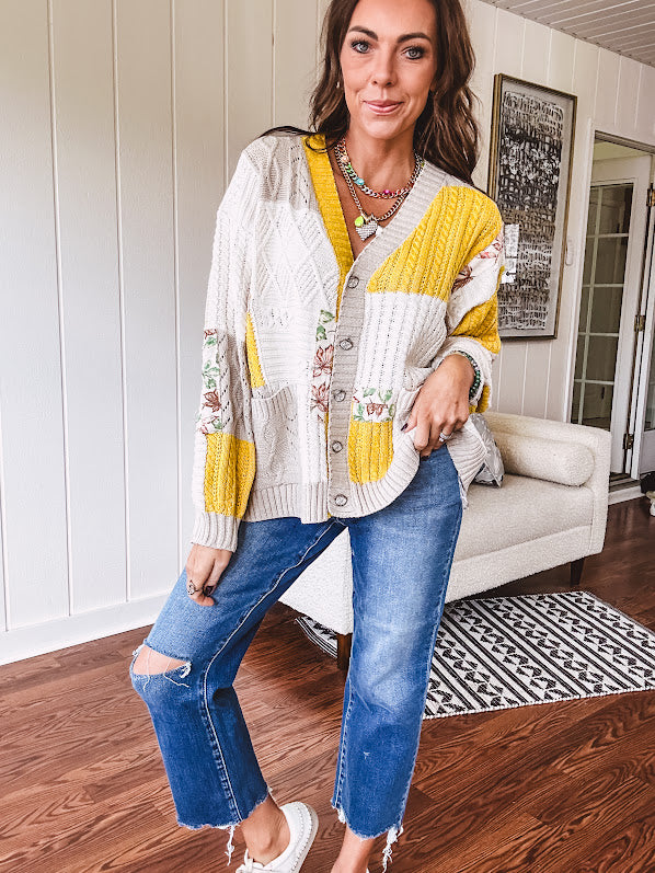 Woven knit button down cardigan with color block patchwork in either mint and green or yellow and taupe.