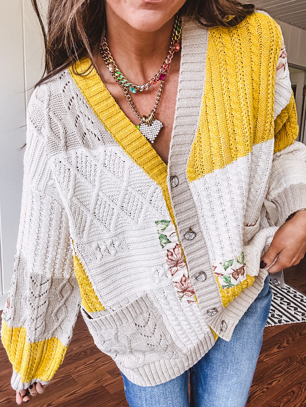Woven knit button down cardigan with color block patchwork in either mint and green or yellow and taupe.