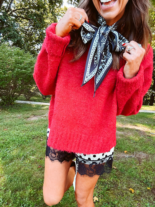 Soft, fuzzy cool red mock neck sweater with wide ribbed neck, cuffs and hem. 