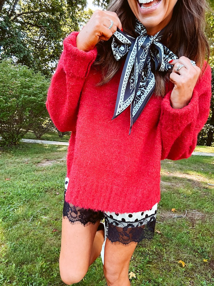 Soft, fuzzy cool red mock neck sweater with wide ribbed neck, cuffs and hem. 