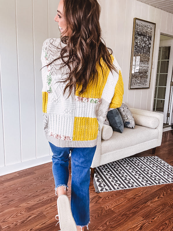 Woven knit button down cardigan with color block patchwork in either mint and green or yellow and taupe.