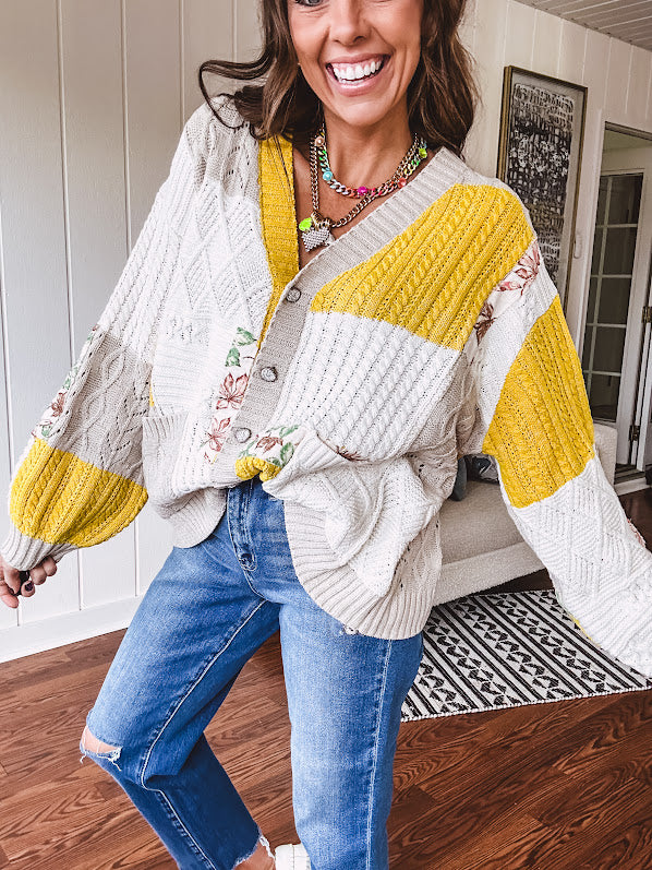 Woven knit button down cardigan with color block patchwork in either mint and green or yellow and taupe.