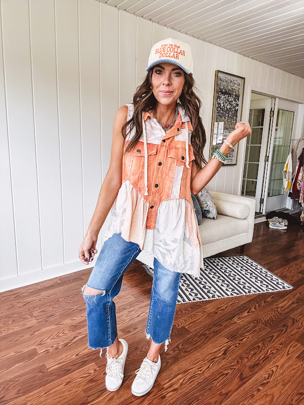 Washed terry like orange brick fabric vest with lace and mixed textured patches, a tiered, flowy bottom, snap button front, hoodie and pockets.