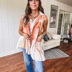 Washed terry like orange brick fabric vest with lace and mixed textured patches, a tiered, flowy bottom, snap button front, hoodie and pockets.