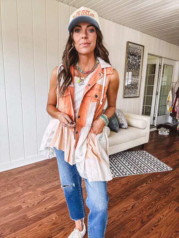 Washed terry like orange brick fabric vest with lace and mixed textured patches, a tiered, flowy bottom, snap button front, hoodie and pockets.