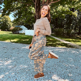 Lightweight cotton balloon pants in gray with golden florals throughout, front pleats and lace trimmed pockets. Button and zipper closure with elastic back.