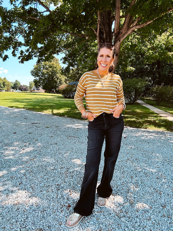 Lightweight, thin, soft striped crewneck long sleeved sweater.