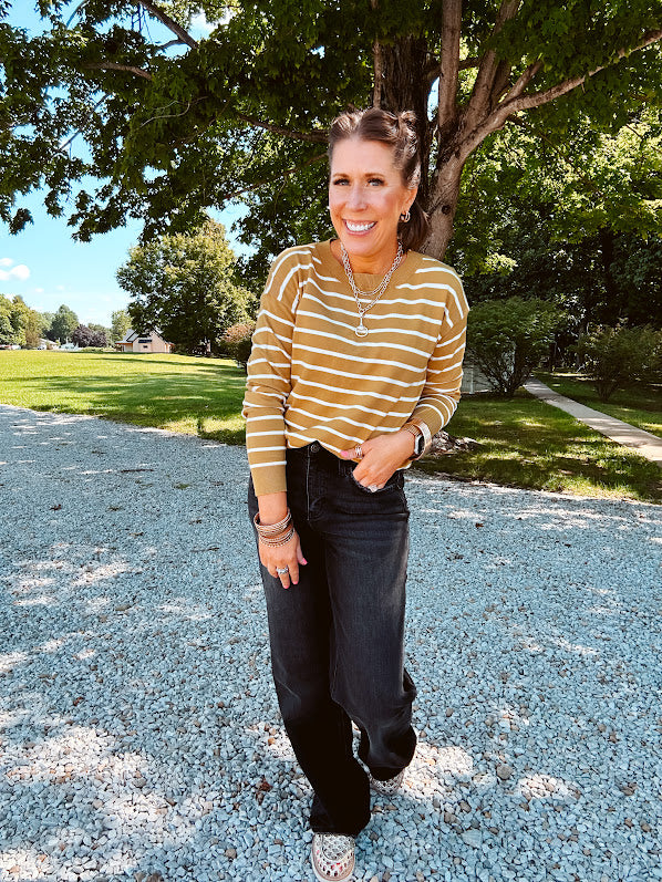 Lightweight, thin, soft striped crewneck long sleeved sweater.