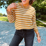 Lightweight, thin, soft striped crewneck long sleeved sweater.