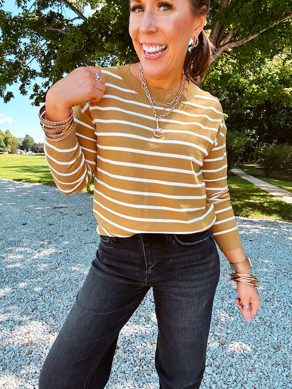 Lightweight, thin, soft striped crewneck long sleeved sweater.