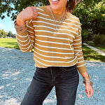 Lightweight, thin, soft striped crewneck long sleeved sweater.