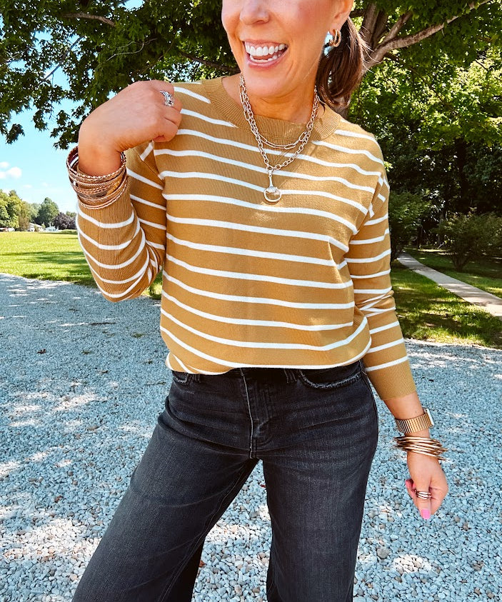 Lightweight, thin, soft striped crewneck long sleeved sweater.