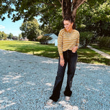 Lightweight, thin, soft striped crewneck long sleeved sweater.