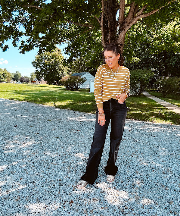 Lightweight, thin, soft striped crewneck long sleeved sweater.